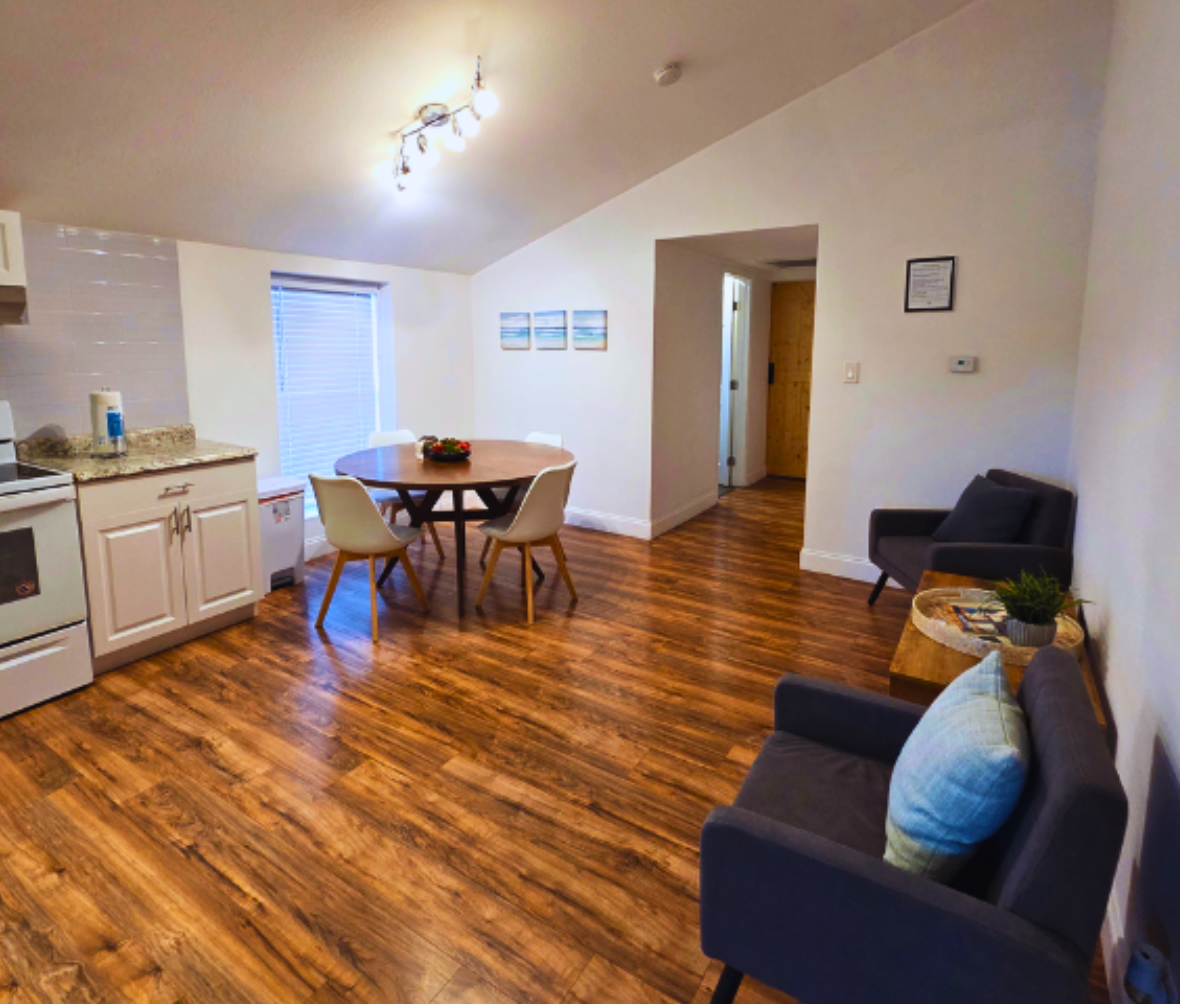Spacious area featuring a cozy living room, dining space, and nearby kitchen. Lakeland, FL