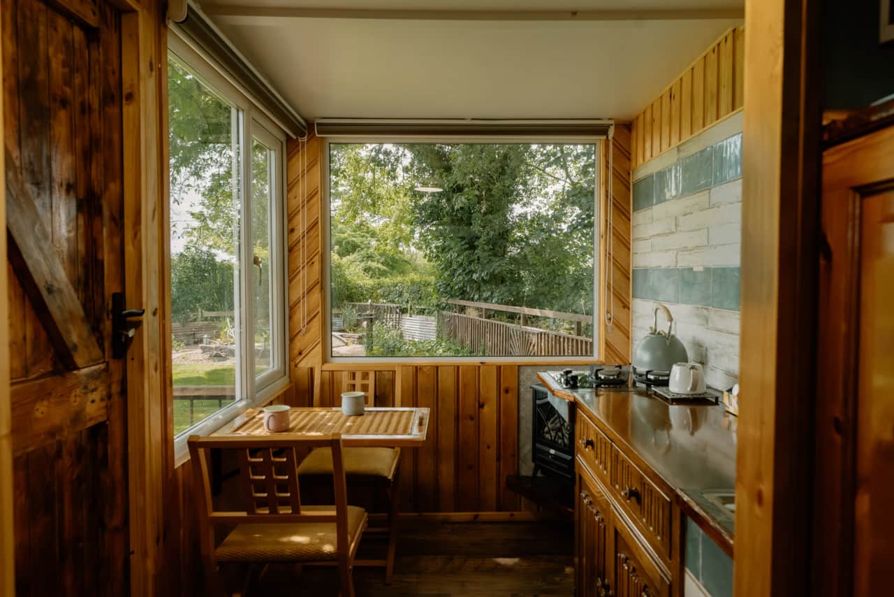 The kitchenette area with gas hob and garden views.