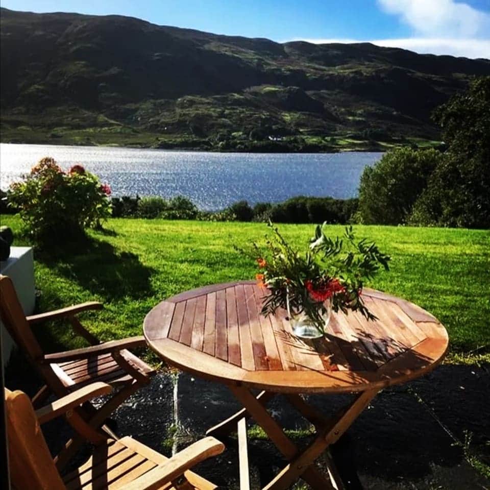 Patio surrounded by wildflowers — the perfect spot for morning coffee in the crisp Connemara air