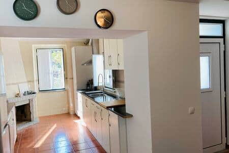 Spacious kitchen with fireplace.