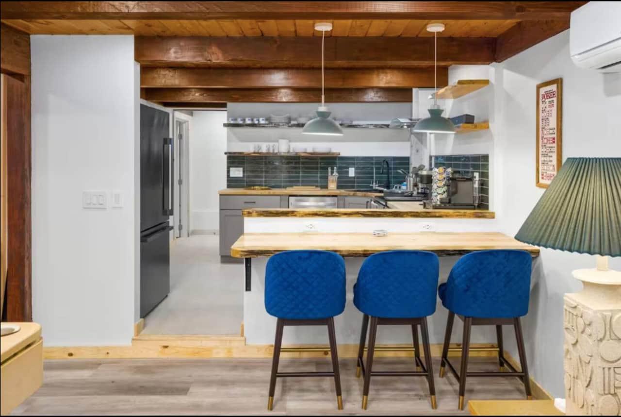 Modern, fully equipped kitchen with spacious island seating—perfect for family meals and gathering together.
