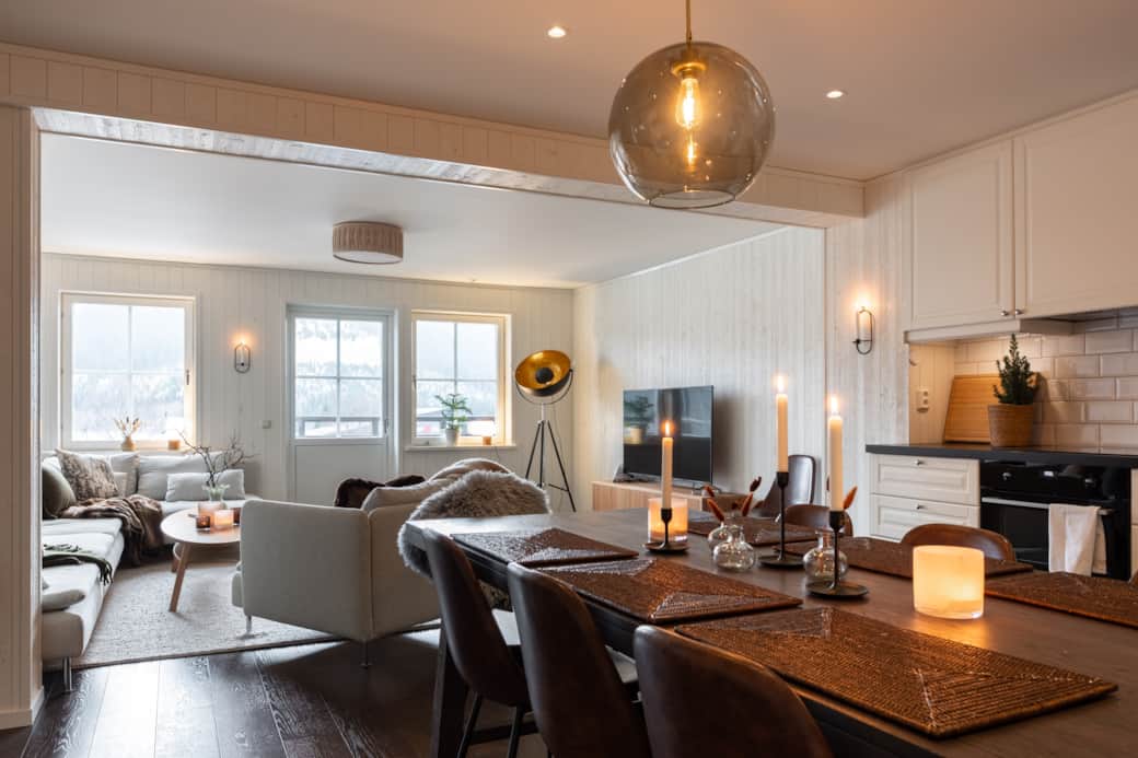 Cozy dining area by the kitchen with an open layout towards the living room.