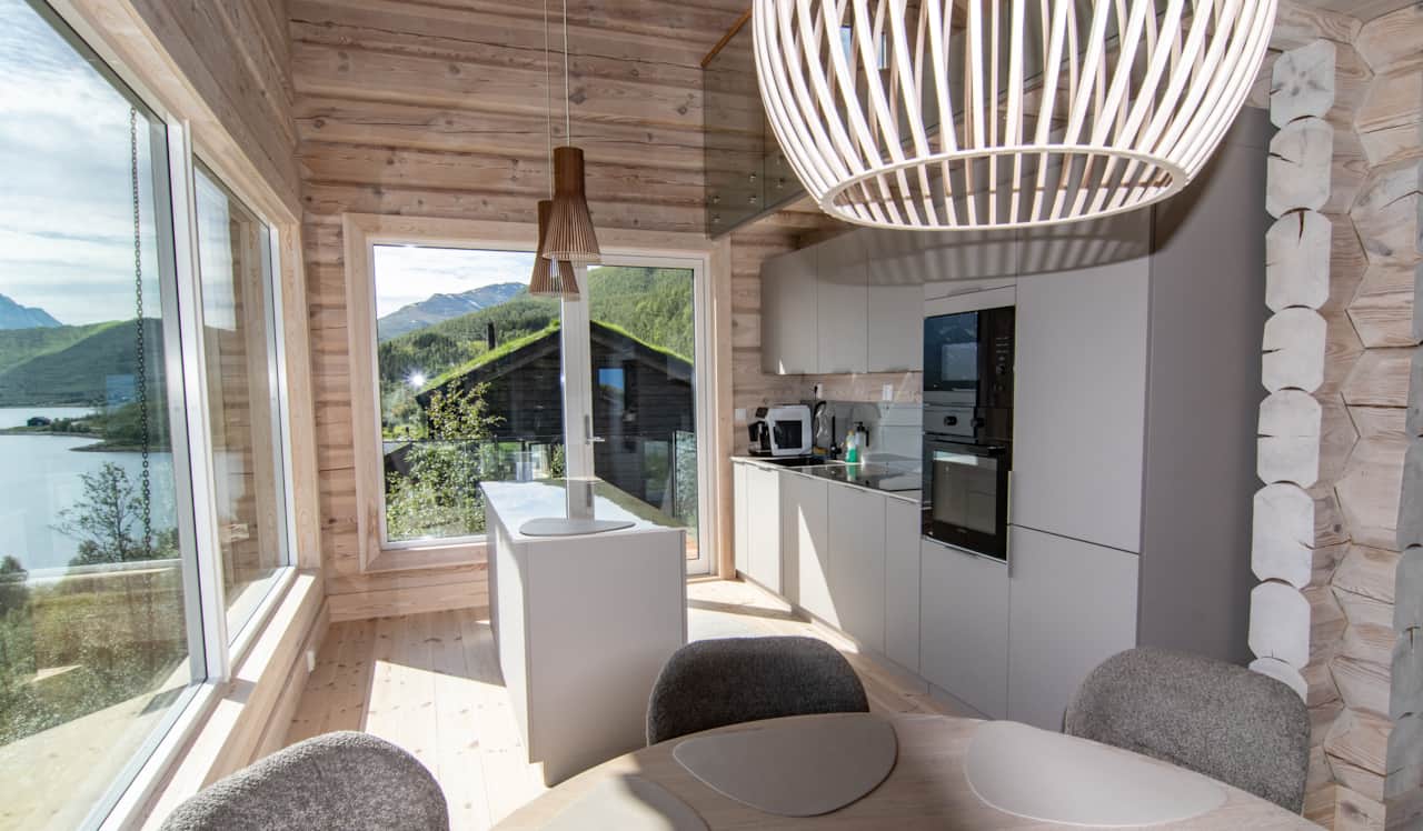 Nordlys open-plan interior with floor-to-ceiling windows facing the fjord