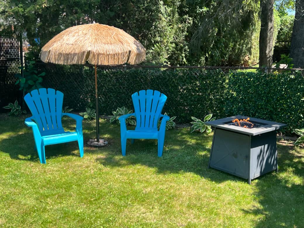 Relax on your private patio with lounge chairs, shade umbrella, and a cozy outdoor fireplace.