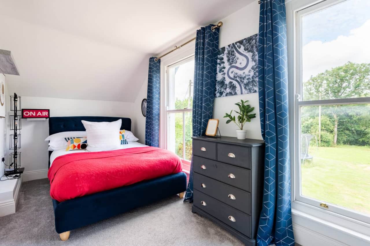 A main-house bedroom with views across the grounds