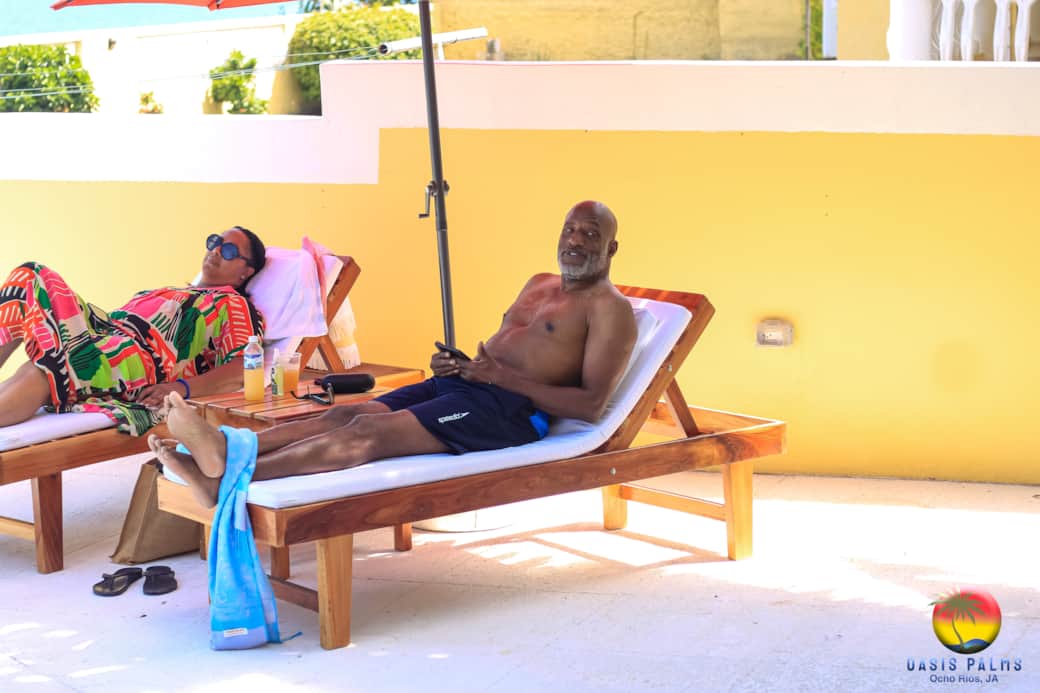 Guests lounging by pool