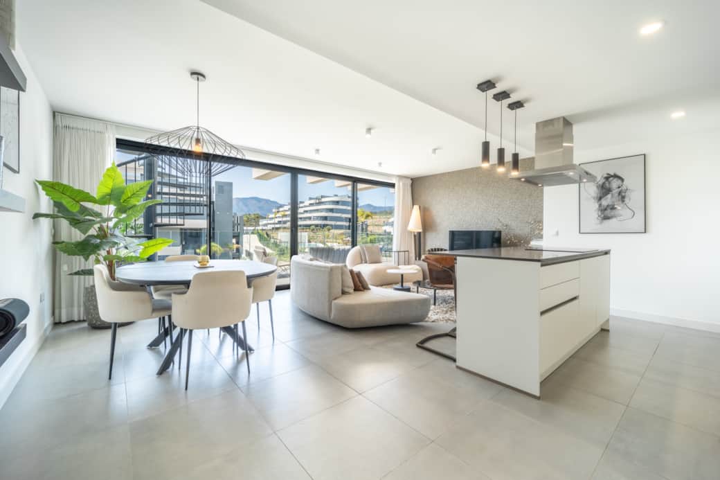Bright lounge area with comfortable dining seating and natural light.