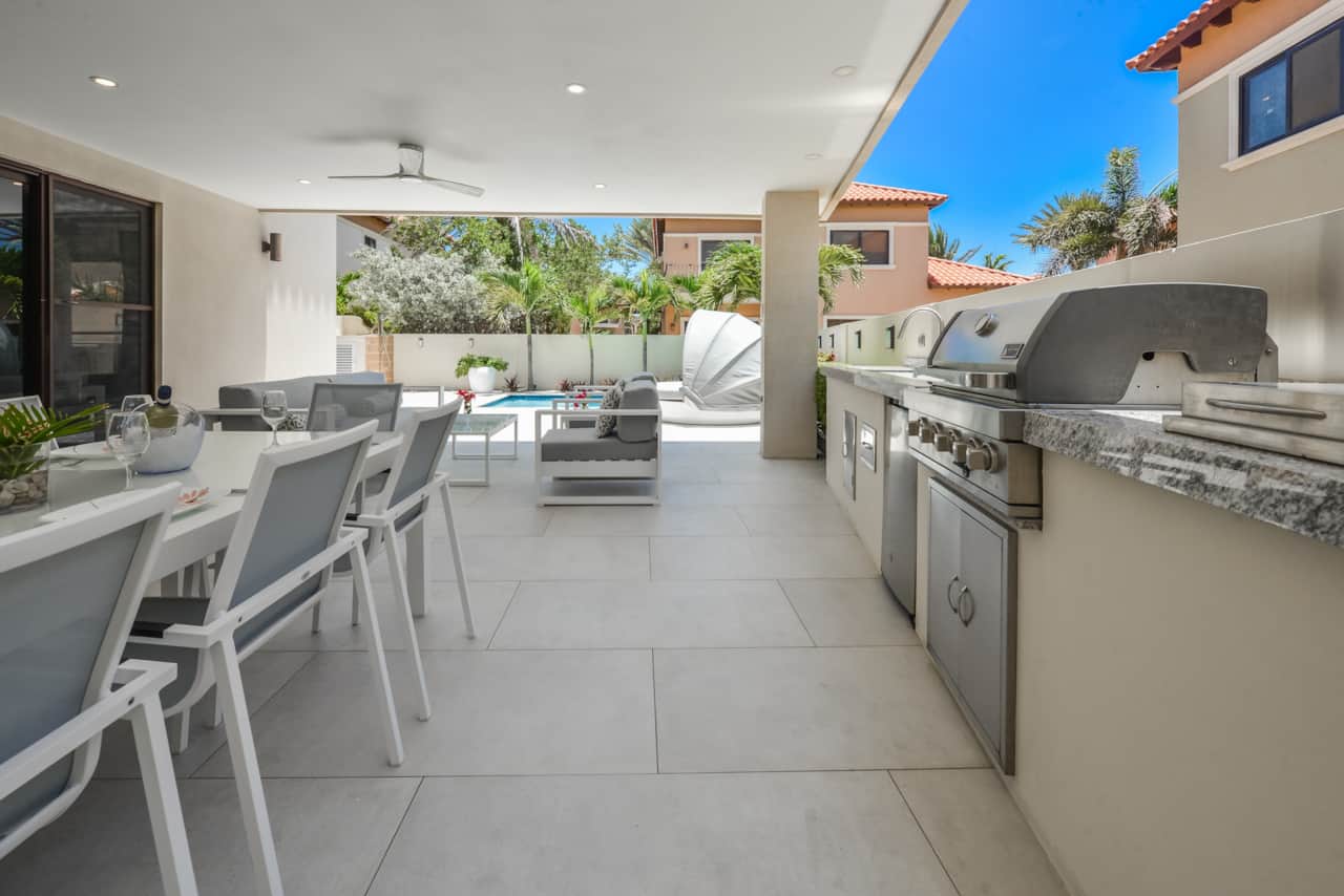 Private backyard with private pool, kitchenette (incl. BBQ, mini fridge), lounging & dining areas
