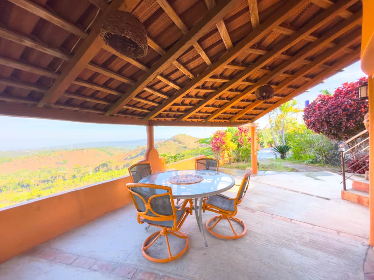 Patio Furniture with views of ocean and vegetaion