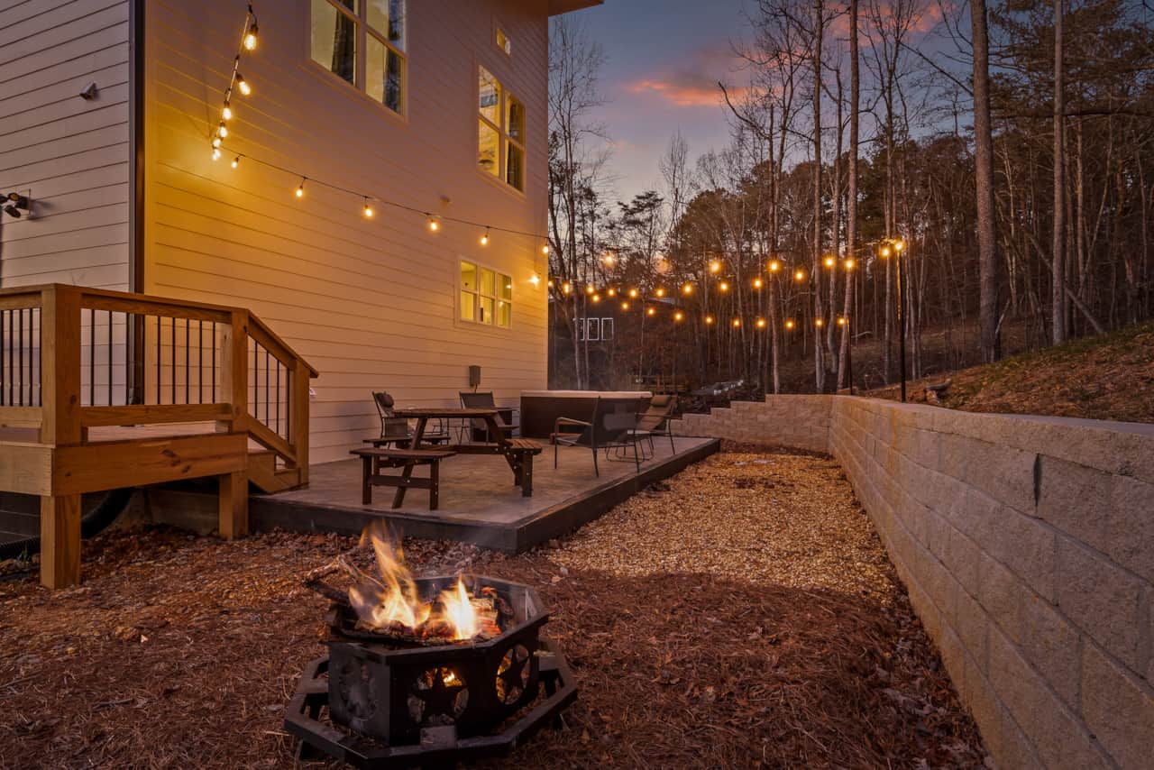 Back Patio with Hot Tub, String Lights, Dining Area, and Chairs