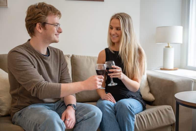 Guests relaxing with a glass of wine in the Windermere lounge