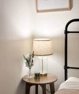 Each side of the bed has its own lamp and nightstand!