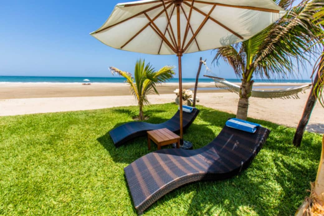 Punta Sal beachfront vacation rental garden lounges