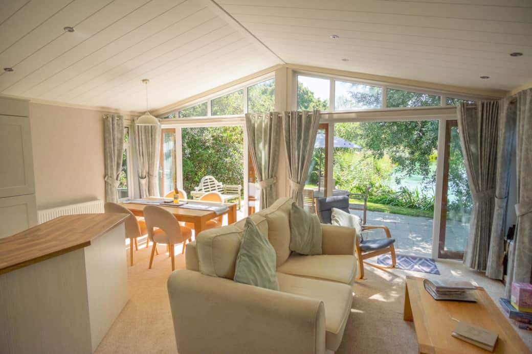 The view as you walk into the living and dining area to Oak lodge with both sets of double doors ope