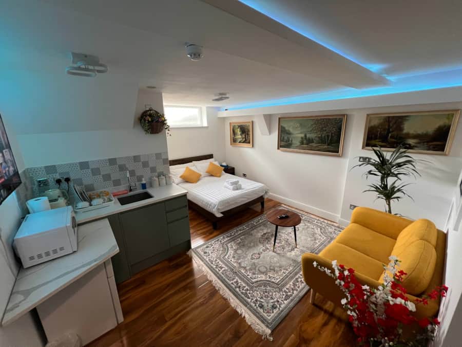 Central Luton Executive Suite with a yellow armchair and soft lighting