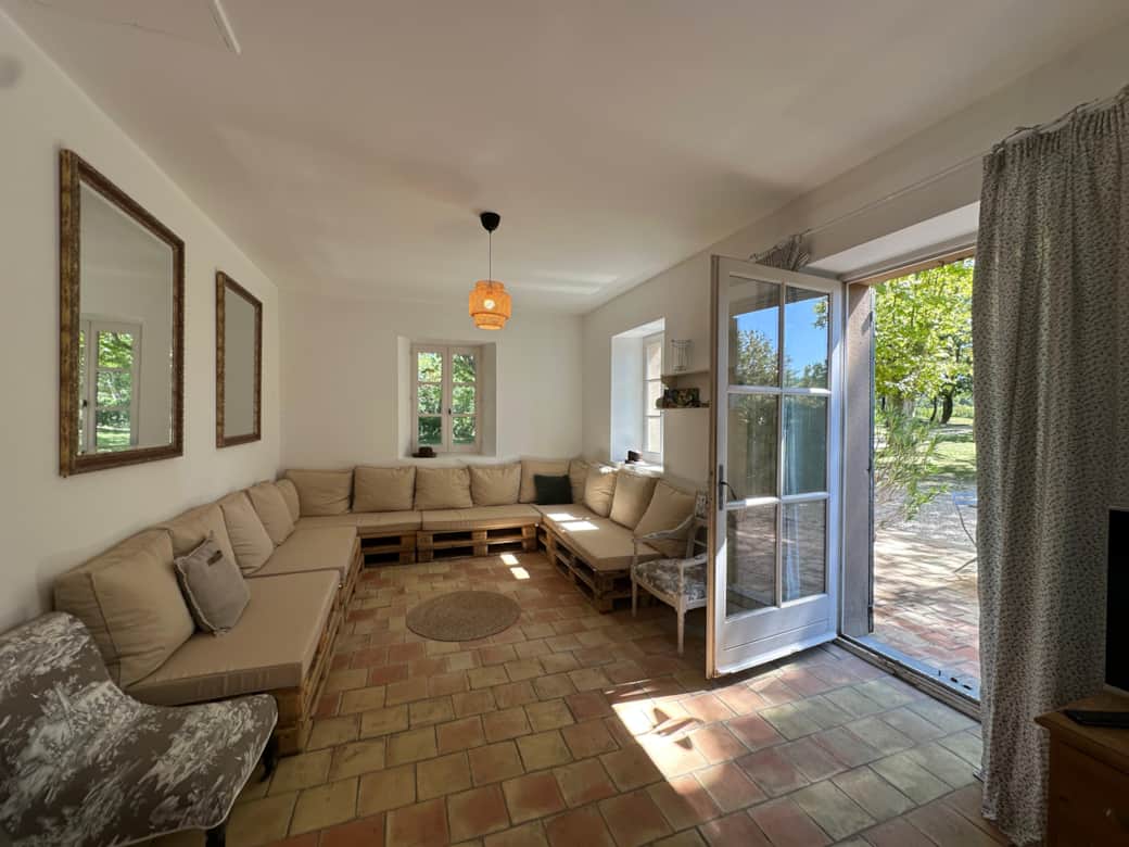 living room, TV, sofas, table, mirror, view on garden
