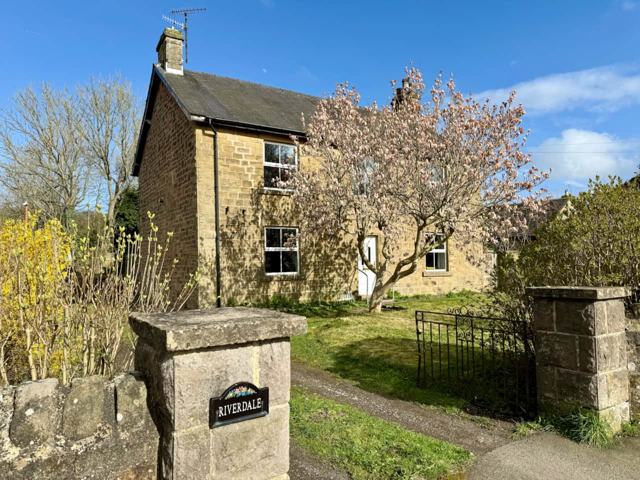 Charming stone home with a welcoming entrance and ample parking