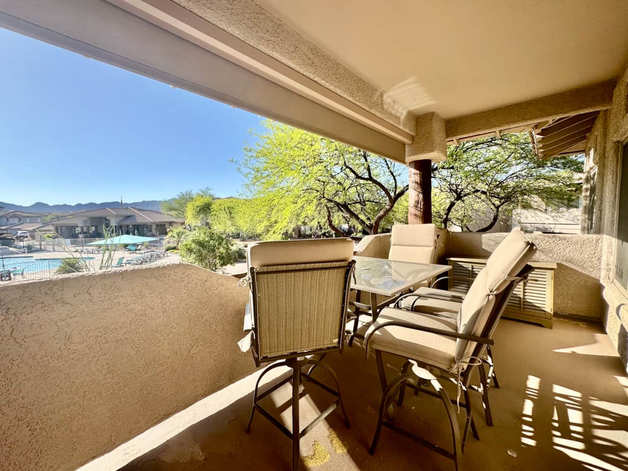 Large balcony overlooking the pool and spa
