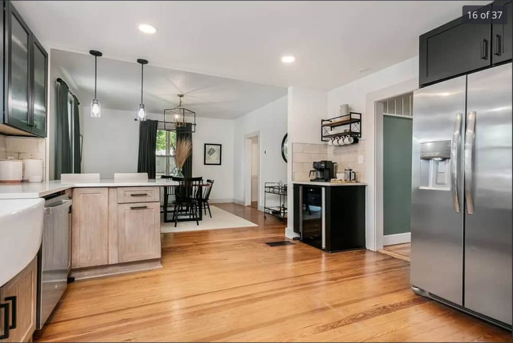 View standing by the stove and looking into the dining room.