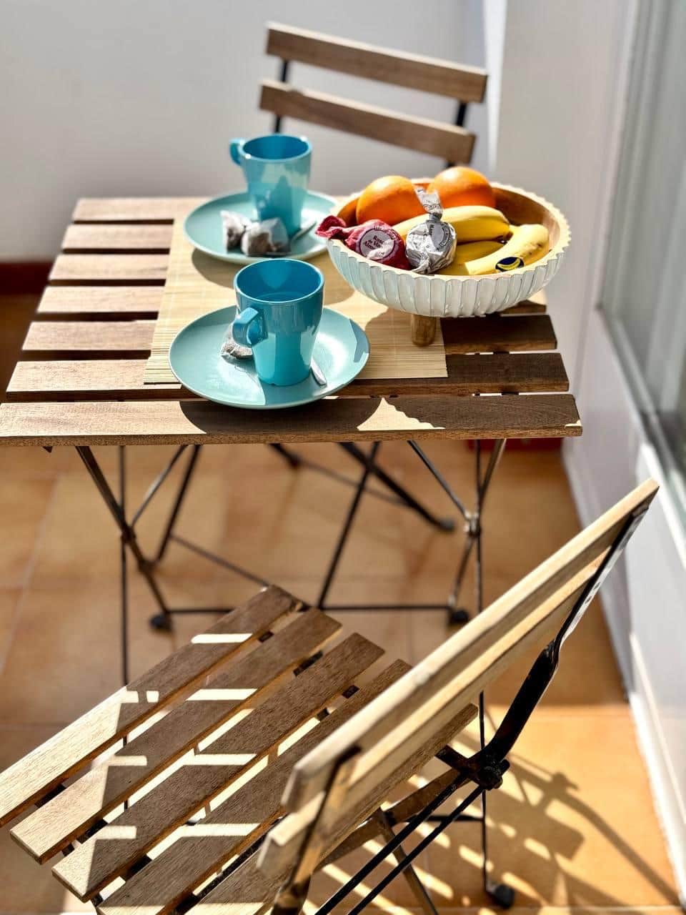 Savor your morning coffee on bright and peaceful balcony