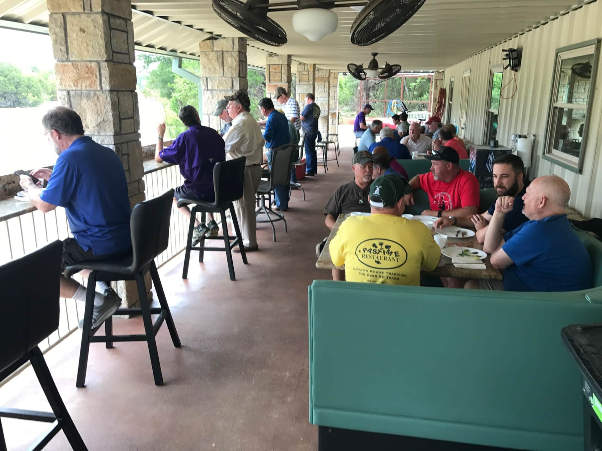Group on the Lodge Porch overlooking Lake Godstone fishing and enjoying meal