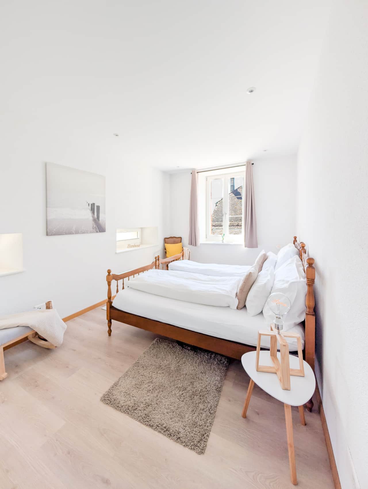 Comfortable and bright room with two single beds.