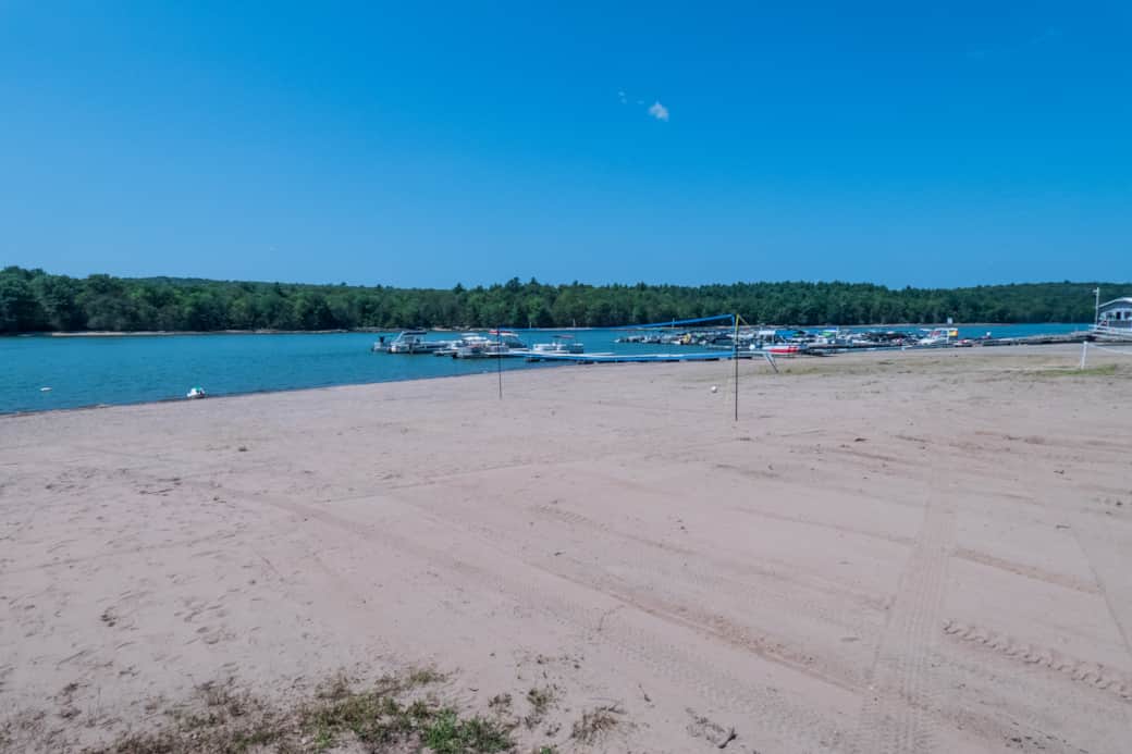200 feet of wide sandy beach with a volleyball net.