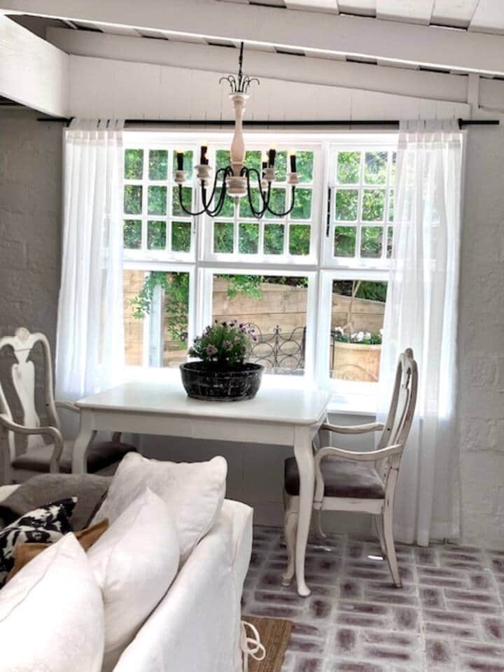 The dedicated dining area is so chosen for the beautiful morning sun that streams through this window every day.
Views of the garden & the romantic aura cast by the antique style chandelier makes for atmospheric & unforgettable dining memories.