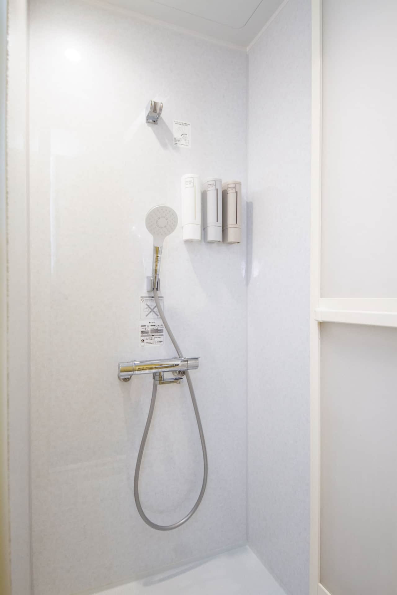 Bright modern shower with fresh amenities.