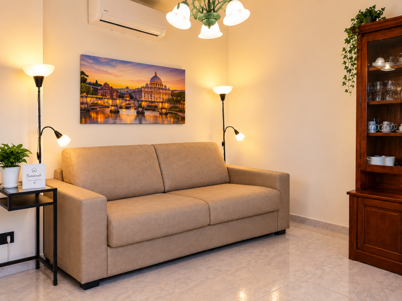 Soggiorno con divano letto chiuso AP Holiday House Roma