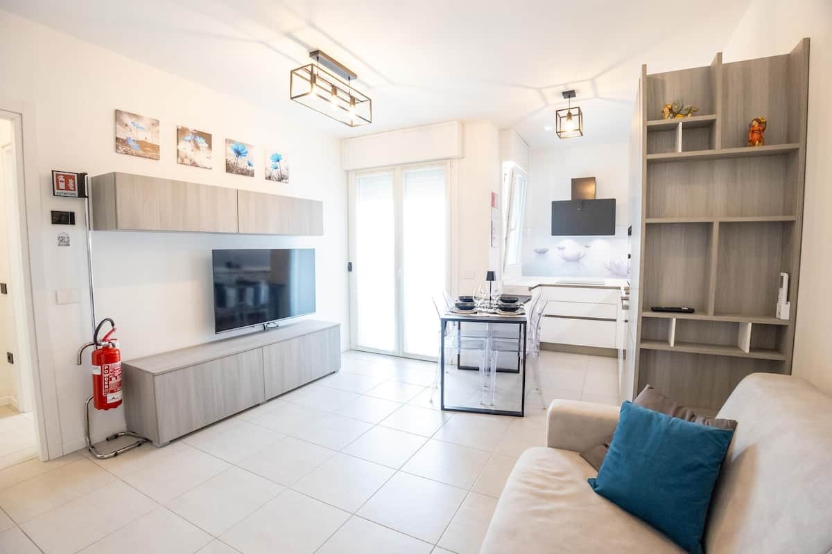 Bright, modern living room with direct access to the terrace
