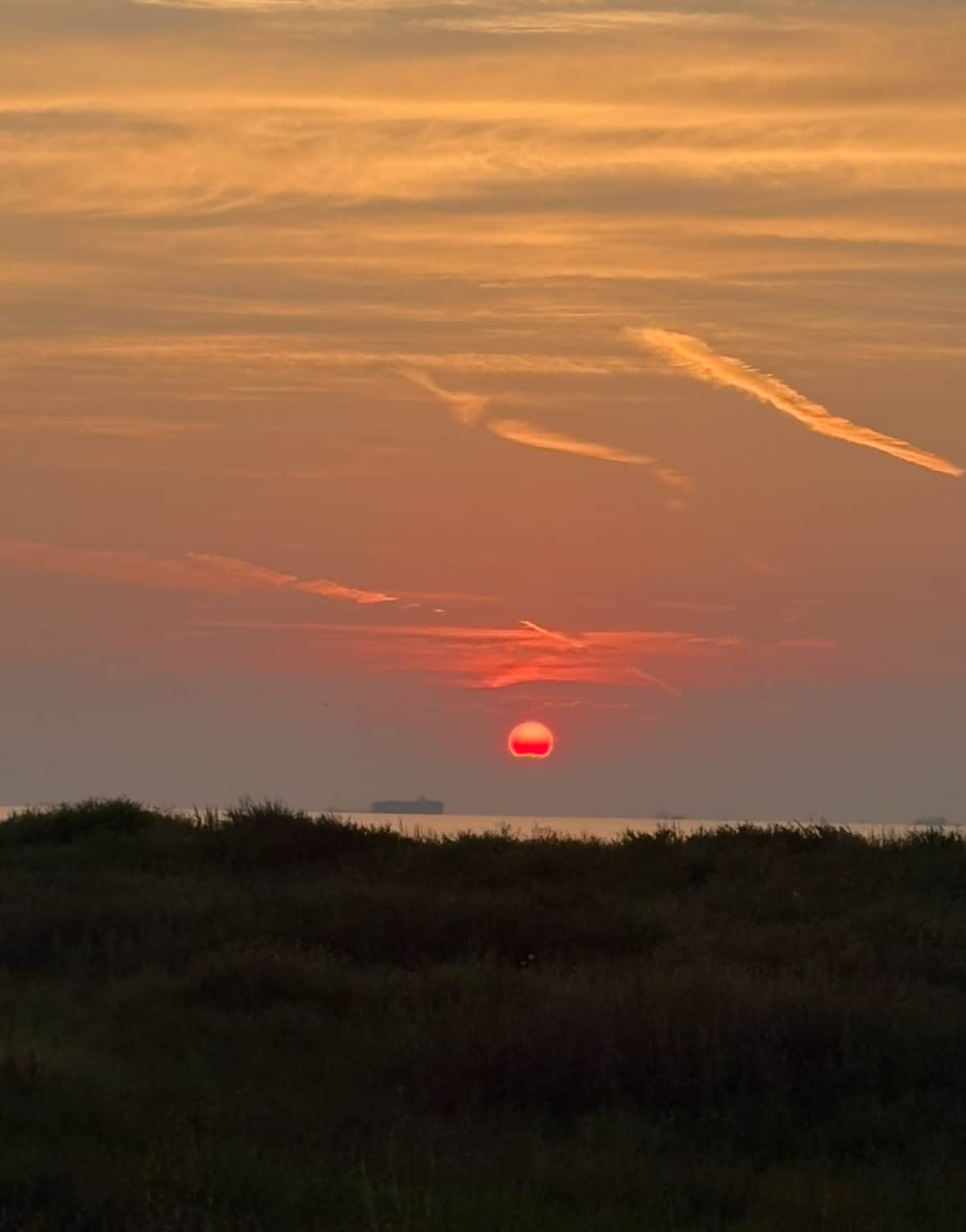 Sunset on the Galveston Seawall during a relaxing winter staycation