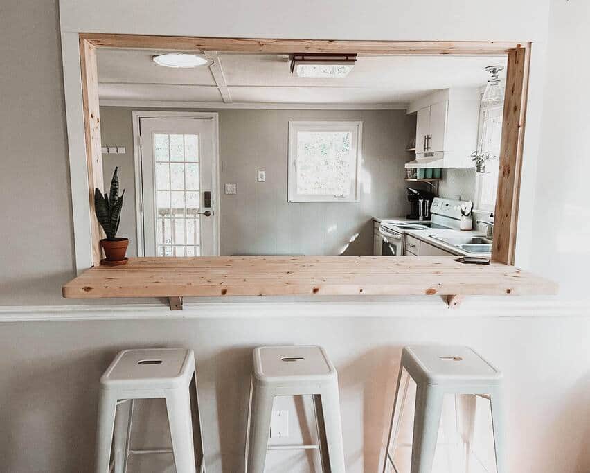 The newly added breakfast bar between the full kitchen and the dining area.