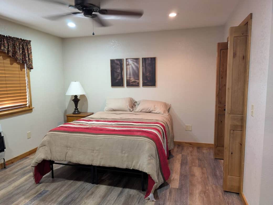 Bedroom with queen bed - There are 2 Twin rollaway beds in the closet that can be placed in the bedrooms or open living area. 