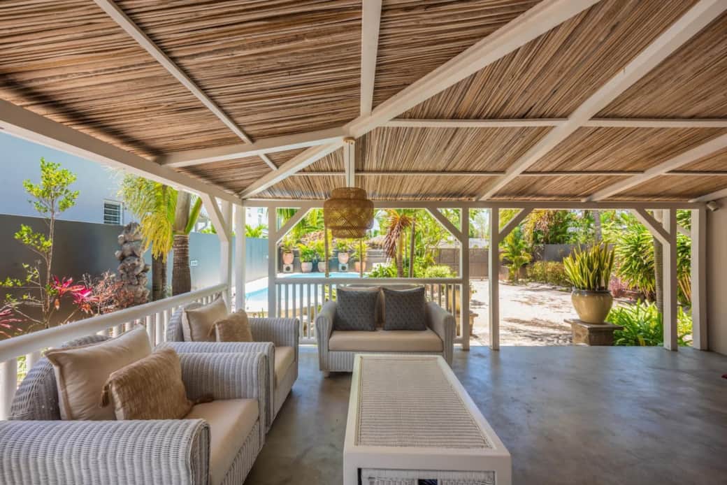The covered terrace overlooking the swimming pool