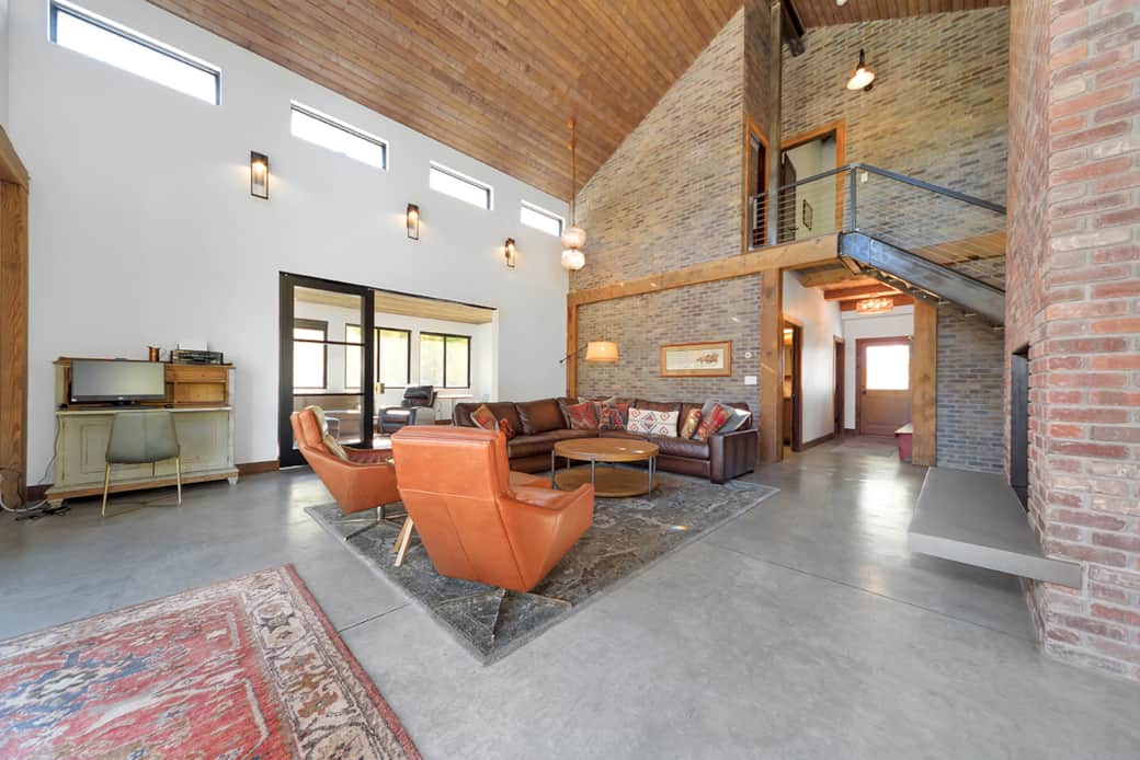 Large living room with tall ceiling
