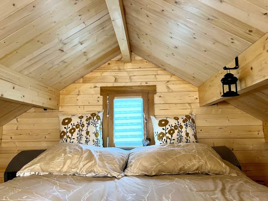 Sleeping loft with very comfy bed, opening window, and lots of storage on either side for luggage. Sleeping loft with very comfy bed, opening window, and lots of storage on either side for luggage.