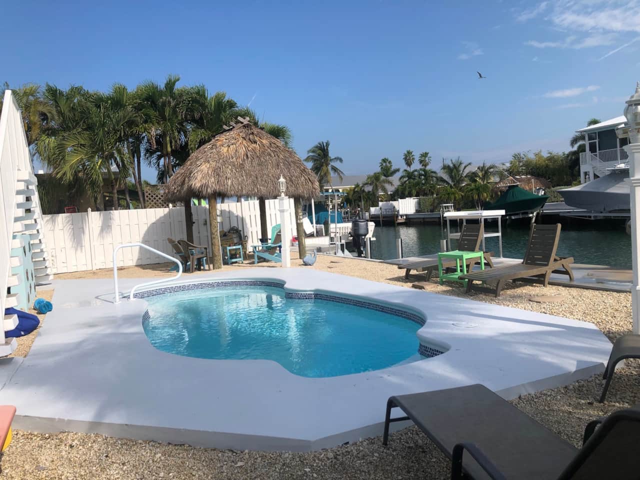 Lovely pool , tiki and dock