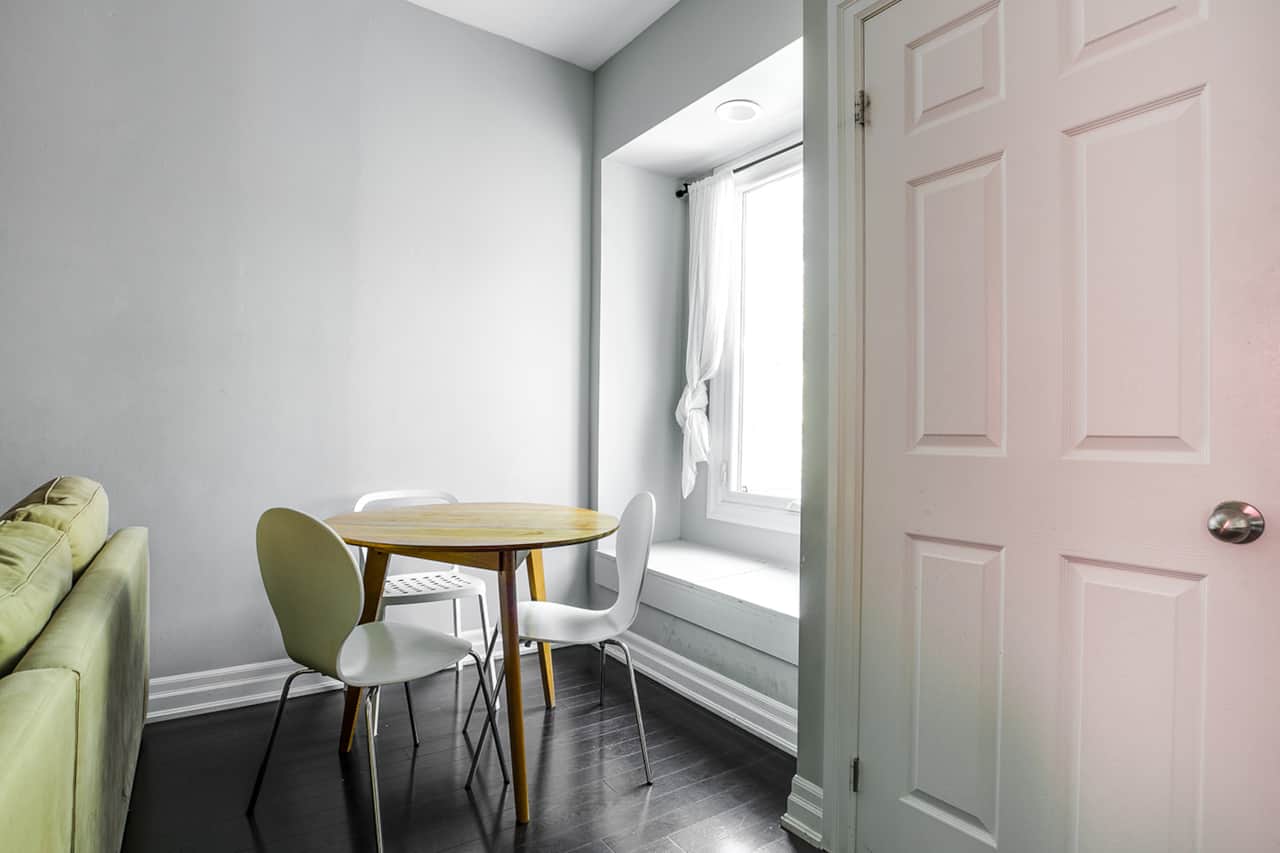 Warm and inviting dining space in a short-term rental, with a compact table set .