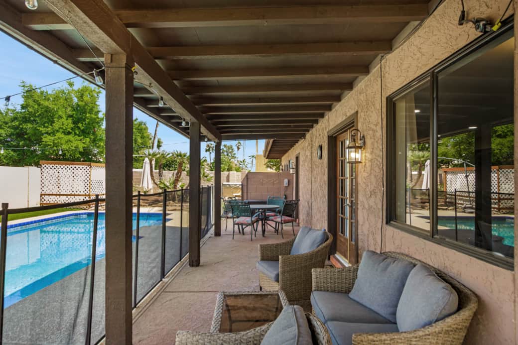 Covered patio with pool views Covered patio with pool views