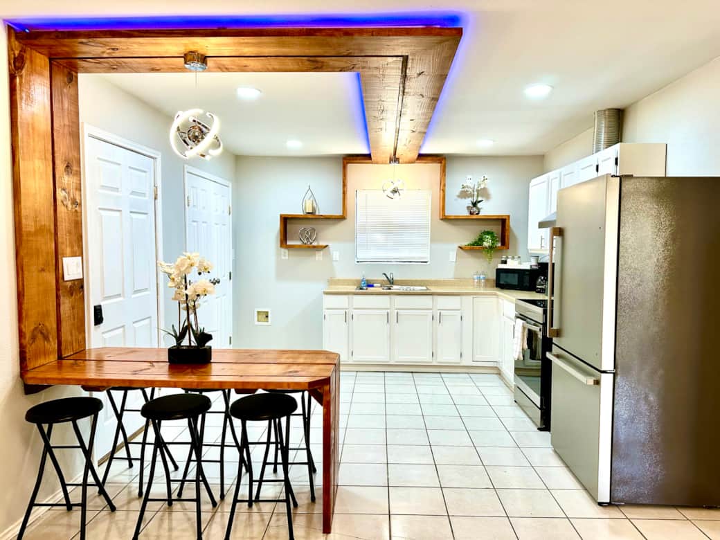 Modern kitchen with led lights that can change color, you decide the mood.