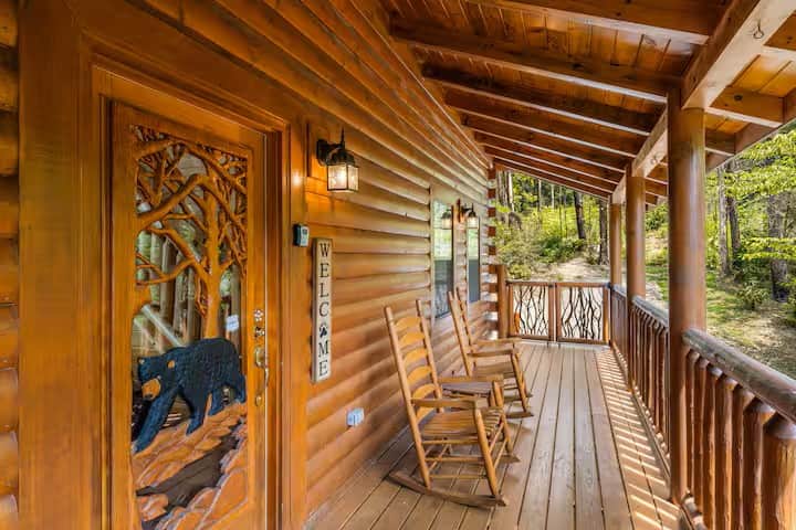 Beautiful front porch offering views of the surrounding woods.