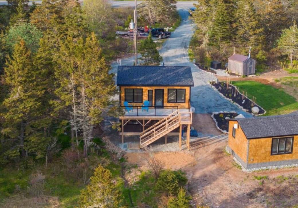 Woodland cabin with elevated deck, garden beds, and private drive Woodland cabin with elevated deck, garden beds, and private drive