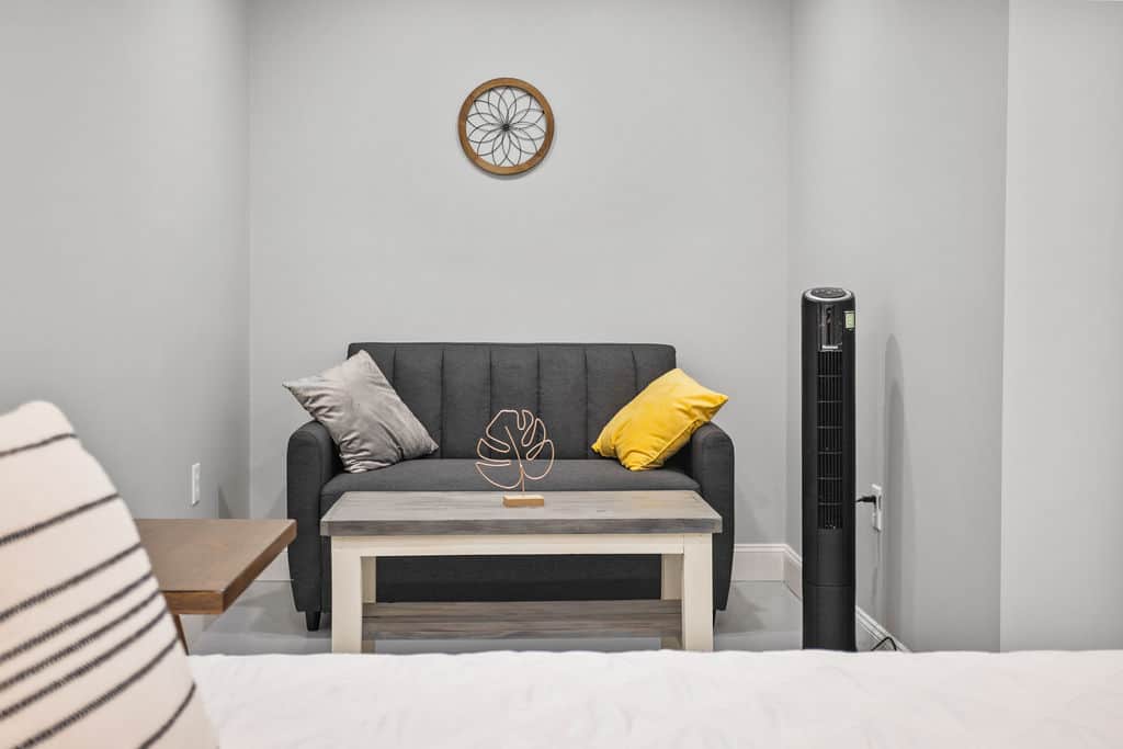 sleeping space for 1 guest on small twin sofa bed and 1 queen bed sleeps 2 