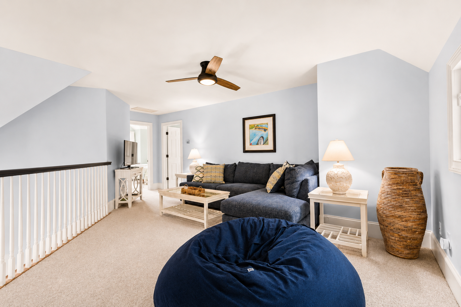 Sink into the bean bag or spread out on the navy sectional upstairs.