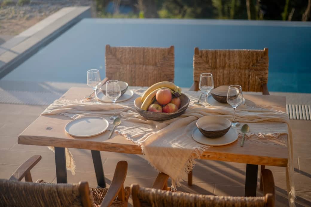 The outdoor dining table is perfect for sunset feasts and starlit conversations. The outdoor dining table is perfect for sunset feasts and starlit conversations.