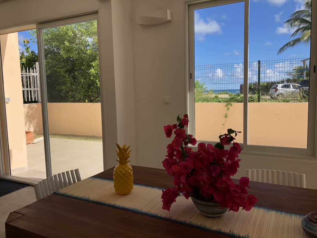 Dining table inside with a view of the terrace Matisse