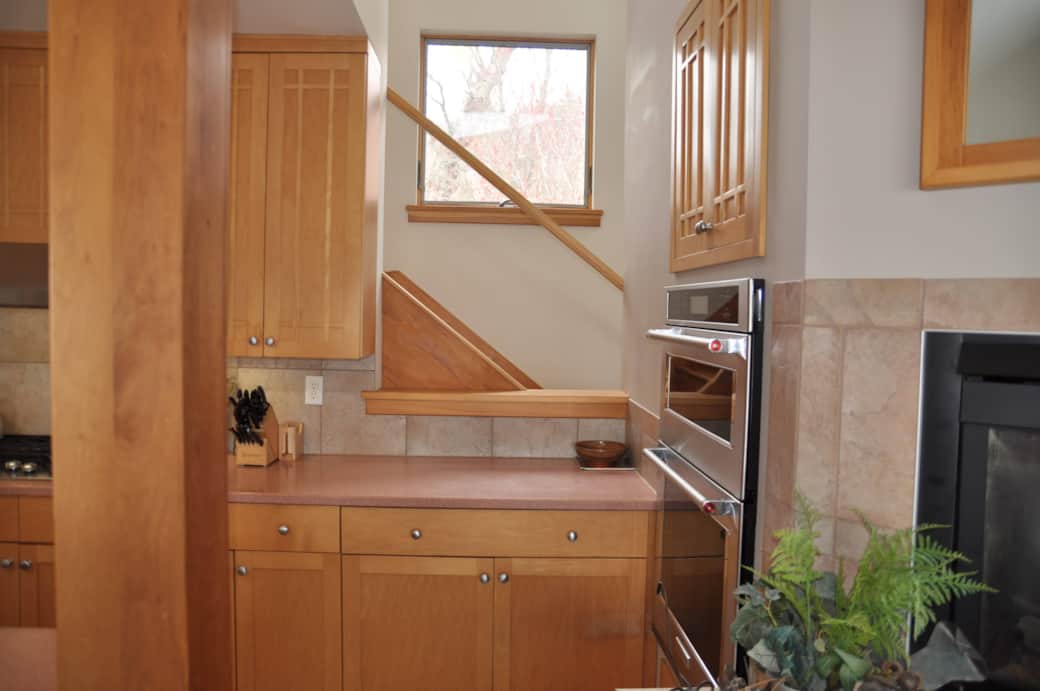 Kitchen and Stairs Leading to Second Floor