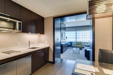 Suite hallway leading from kitchenette to private living and bedroom areas