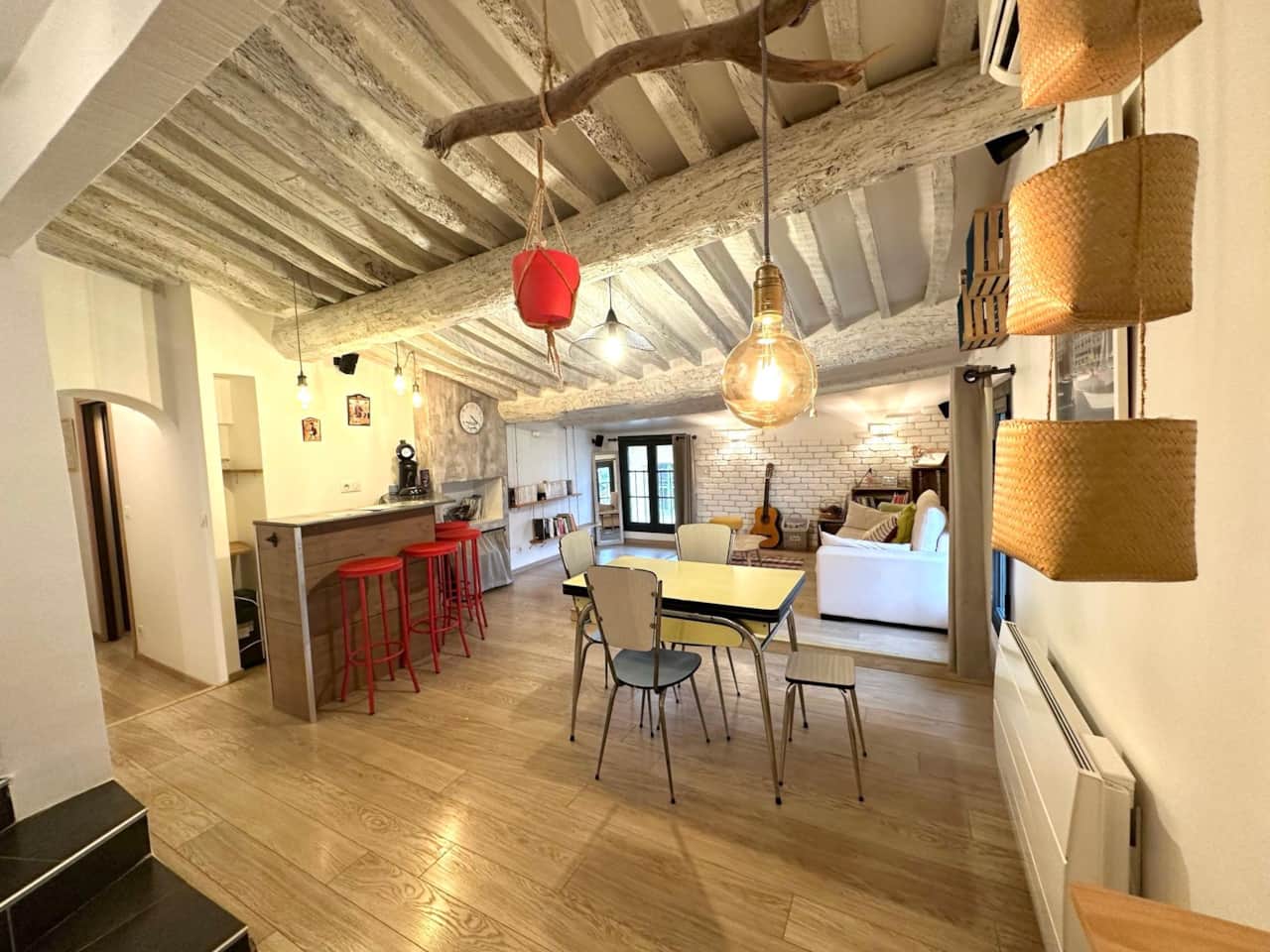 Living room, dining room, dining table, counter, sofa, guitar